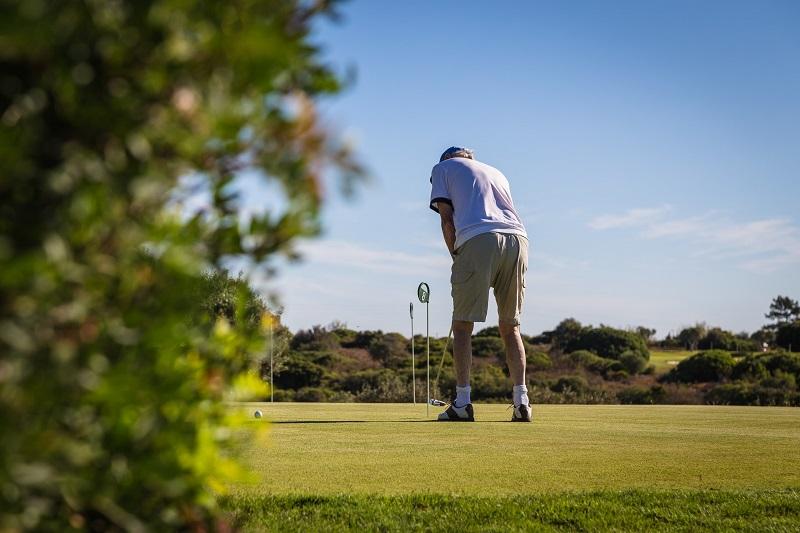 golfer on putting green